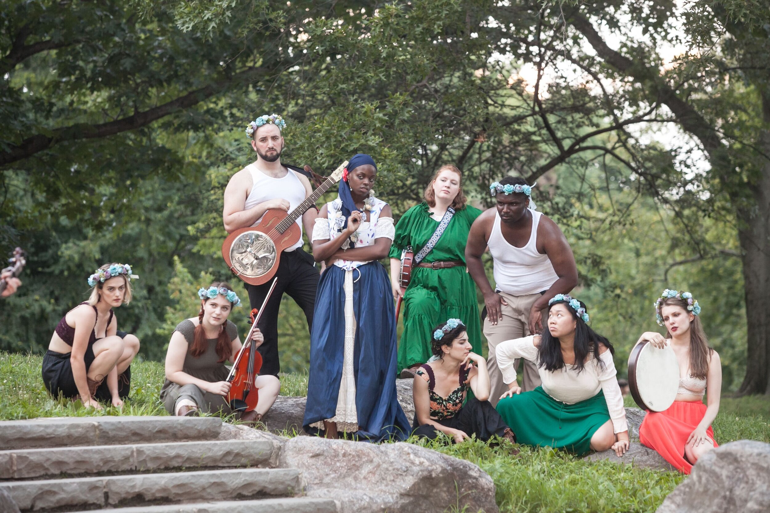 A group of performers dressed as characters from A Midsommar's Night Dream pose in Central Park