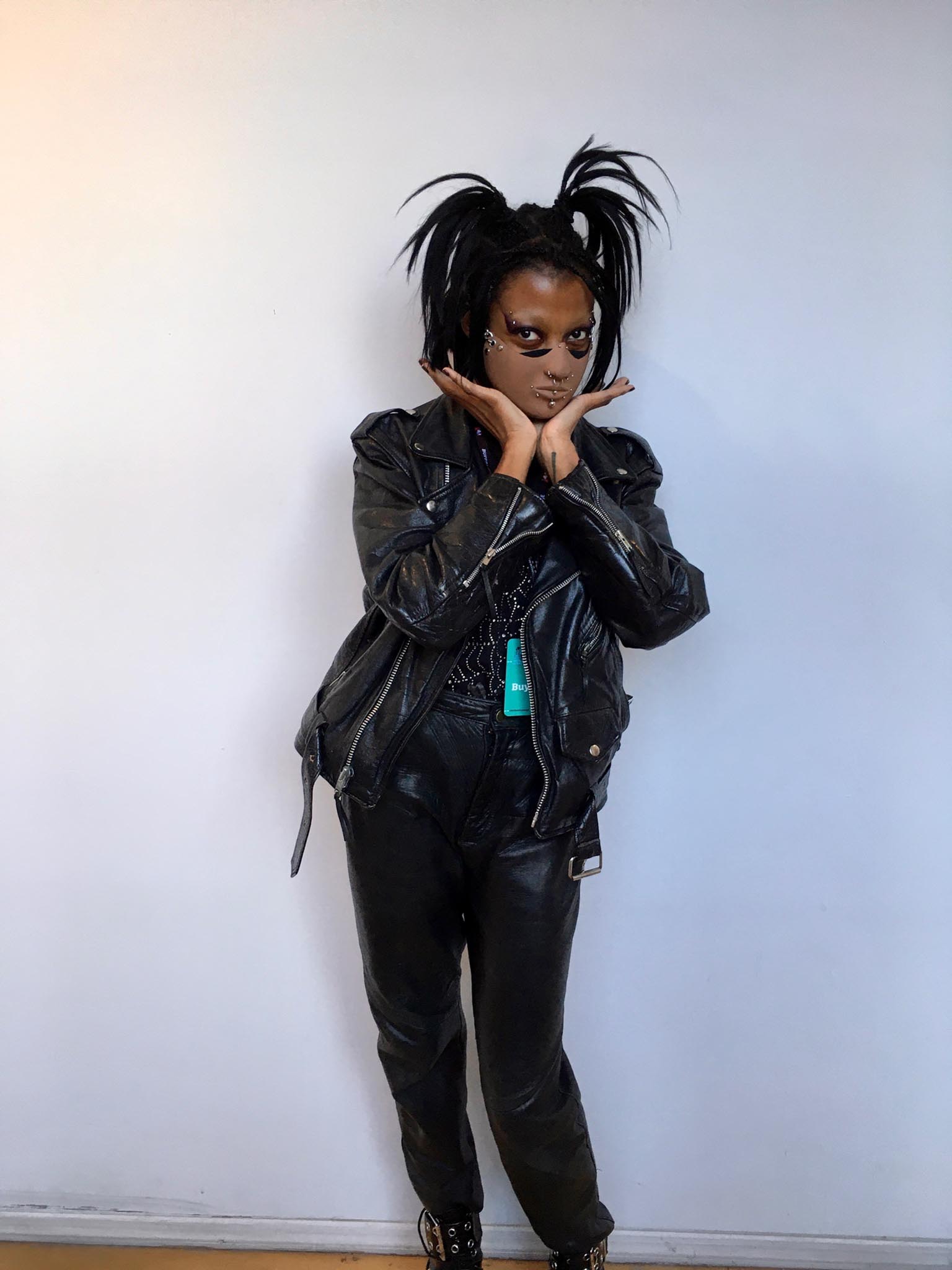 Person standing in front of white wall indoors wearing Edward Scissorhands-inspired costume