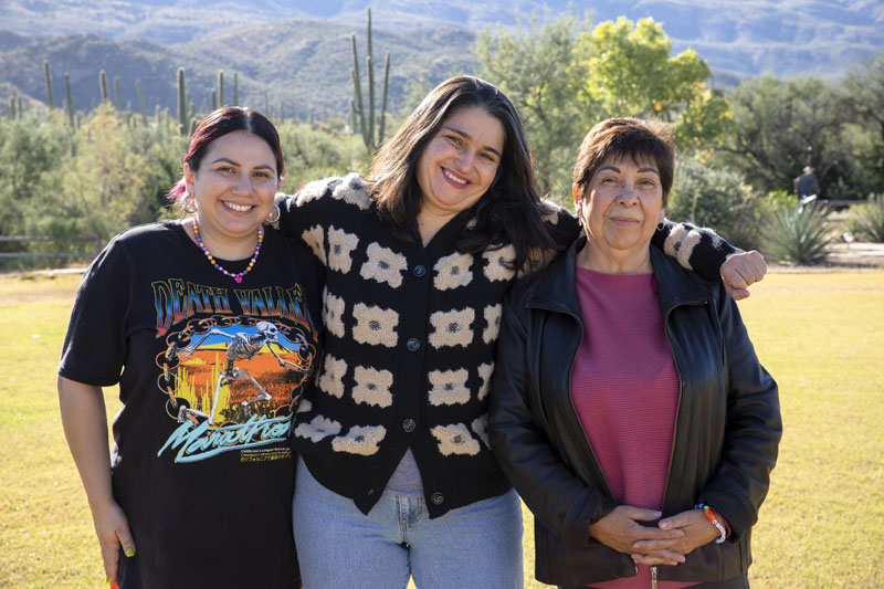 Buffalo Outlet employees Monique, Mina, and Maria at a company meeting in Tucson