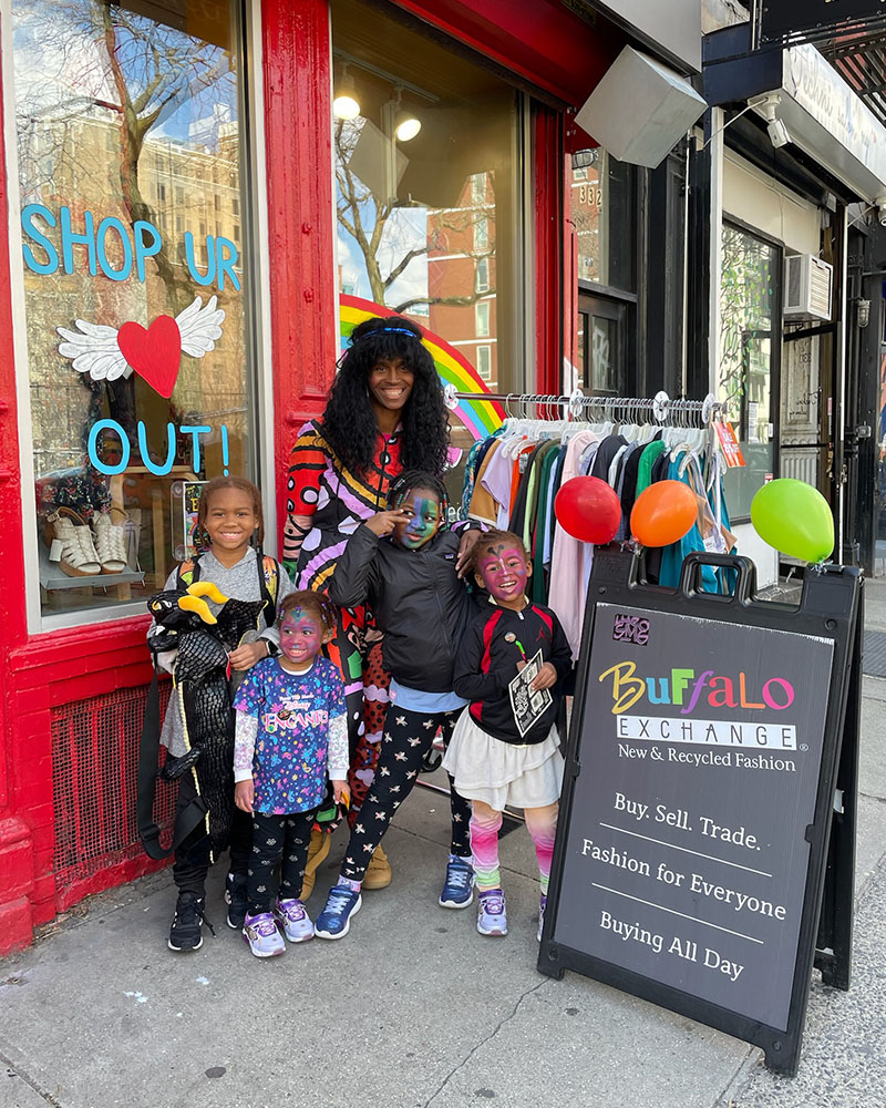 Person and four children with faces painted