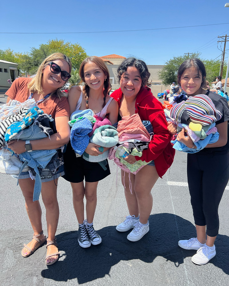 A group of friends shopping the $1 sale