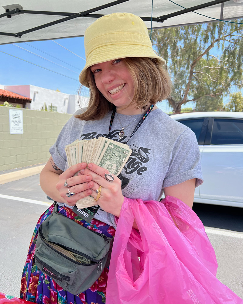 Buffalo Cashier showing off dollar bills