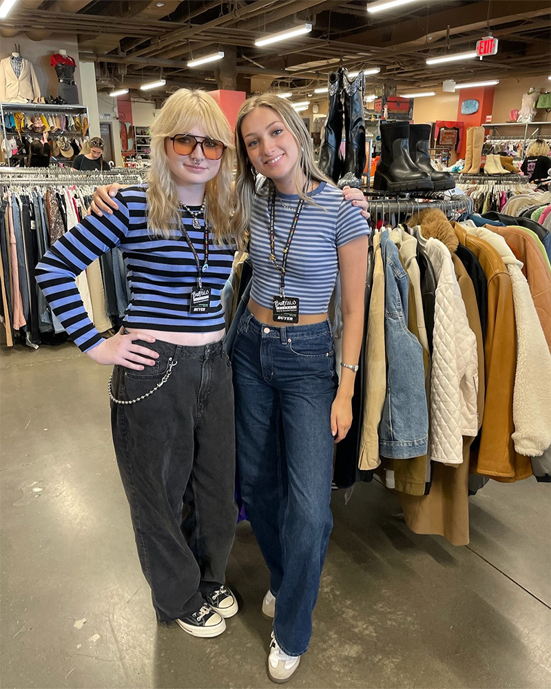 Two buffalo employees in matching striped tees