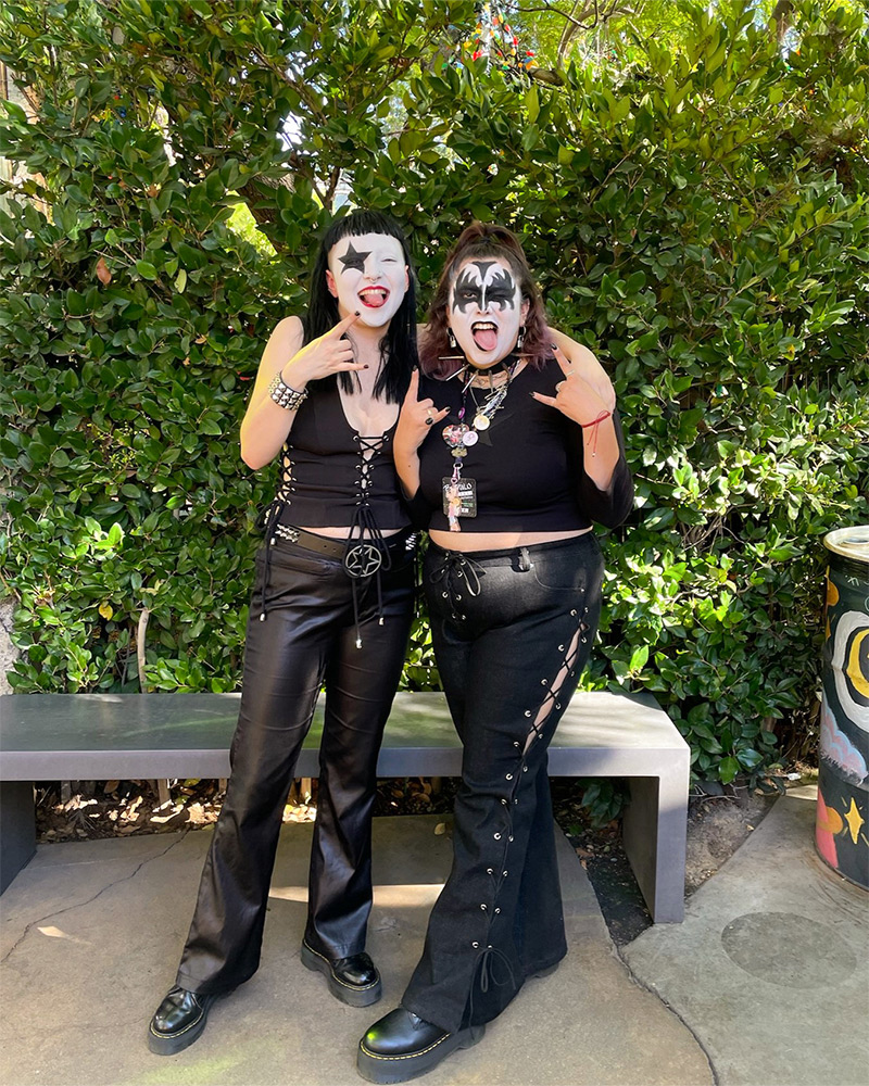 Two people dressed as Paul Stanley and Gene Simmons from the band Kiss 