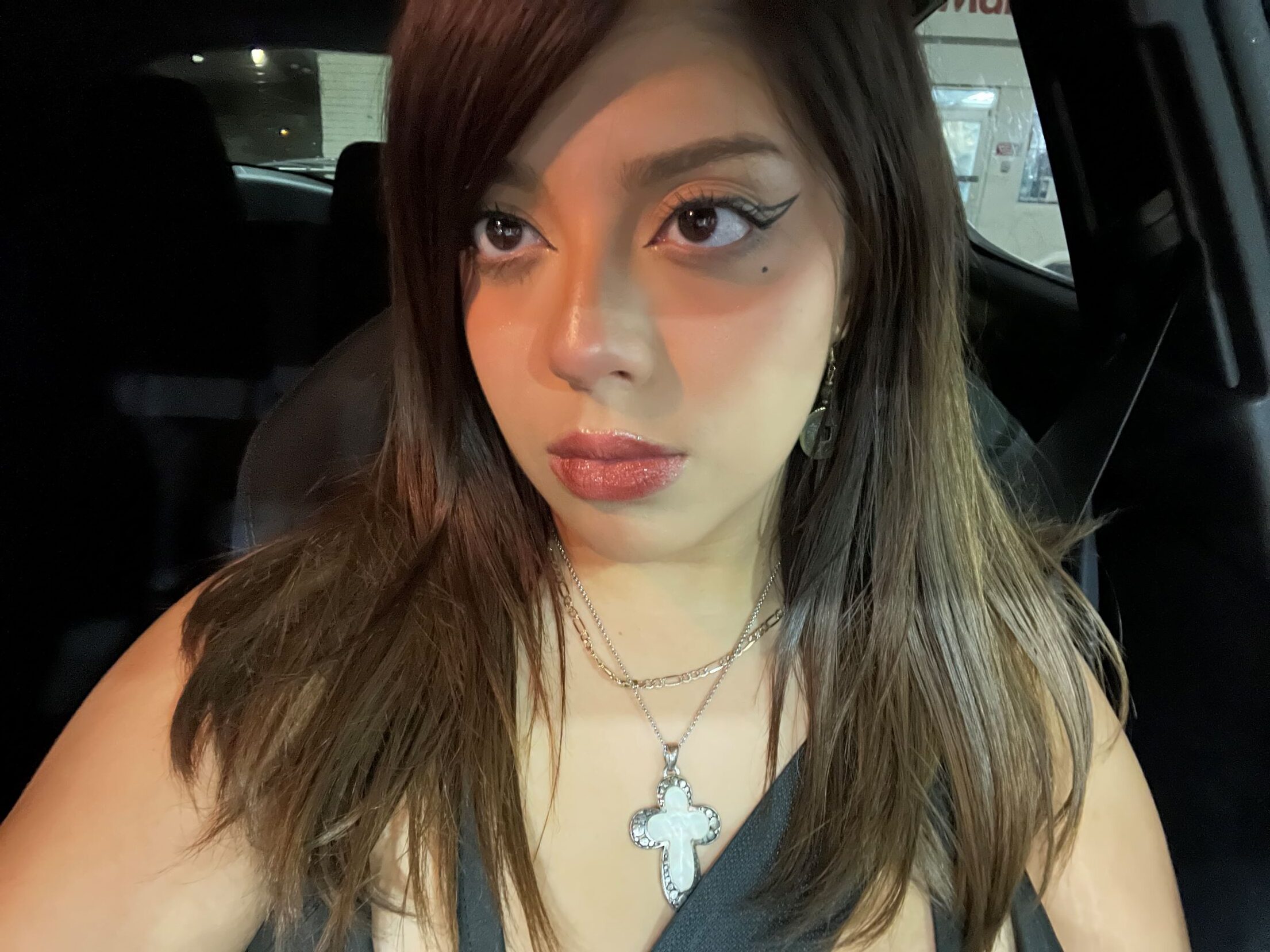 Daniella sitting in a car