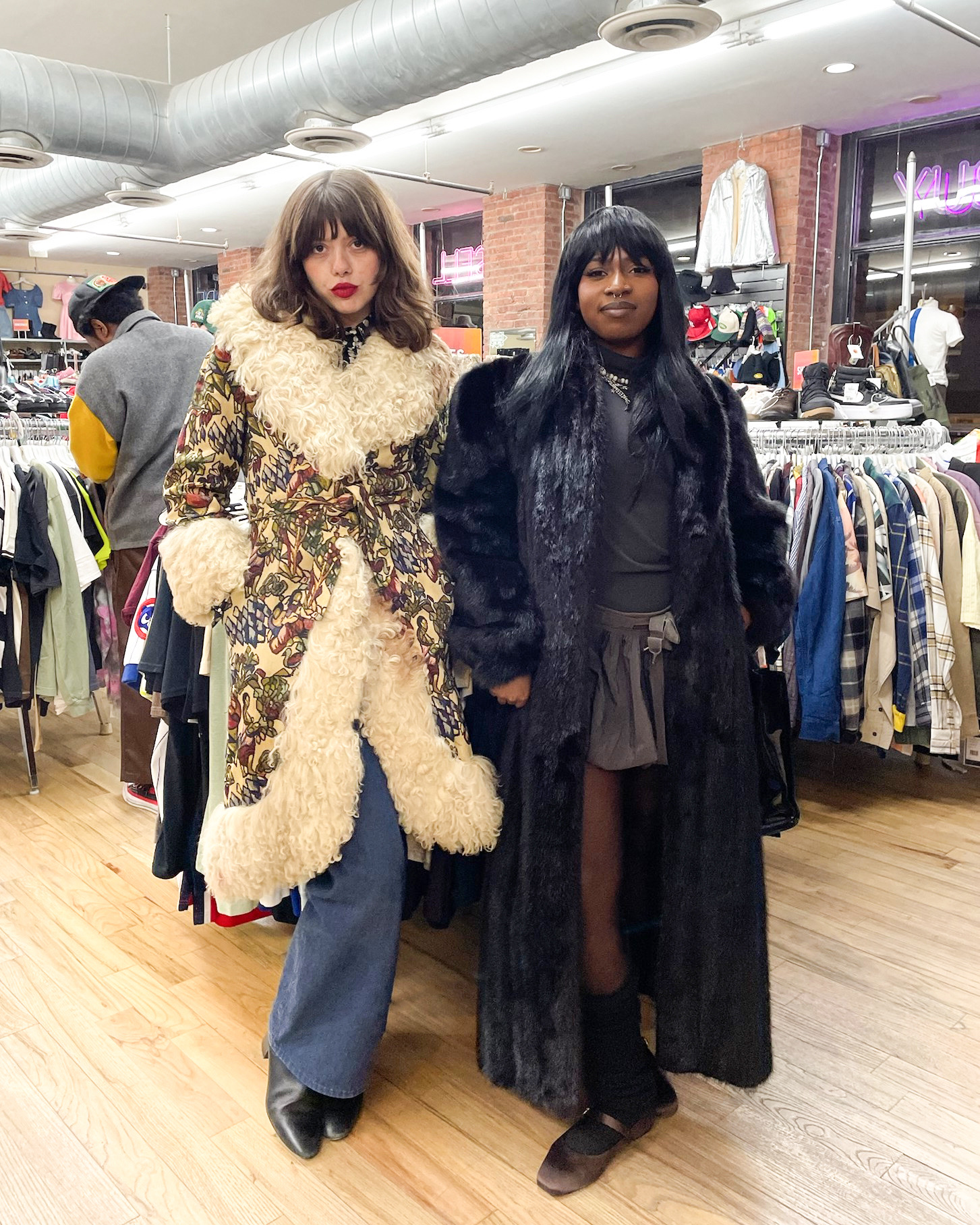2024.11.15 NY1 Winter Style Heavy Coats Two people wearing large, ornate fur-lined coats