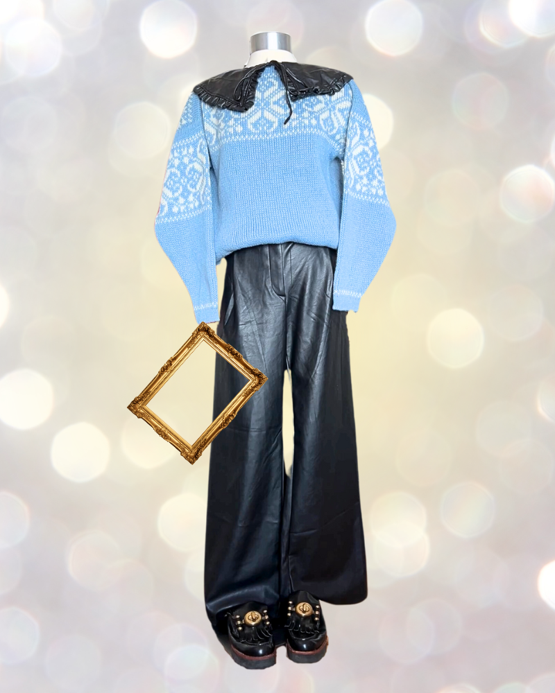 3 Mannequin holding picture frame wears blue Fair Isle sweater and leather pants