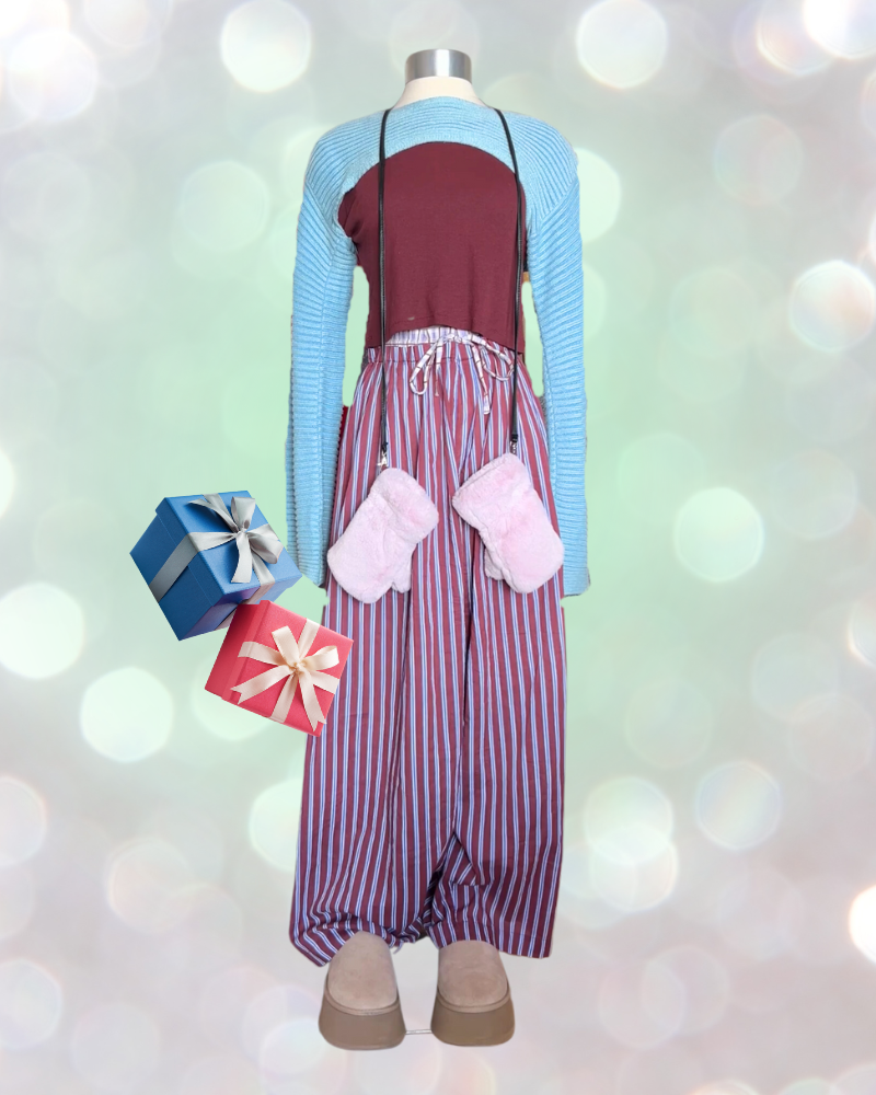 6 Mannequin holding wrapped gifts wears striped pajama pants, Ugg boots, red t-shirt and cropped blue sweater